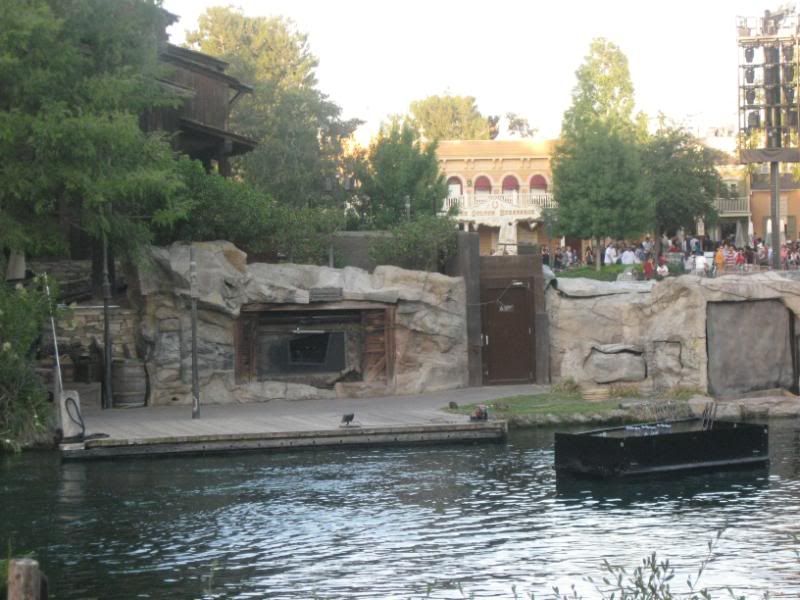 In this picture you can clearly see the door that hides the projector in the day that opens prior to Fantasmic!  This projector is what shoots imagery onto the waterscreens.