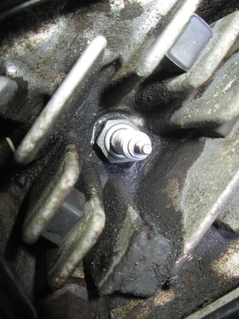 Fixing a cross threaded spark plug hole from the outside