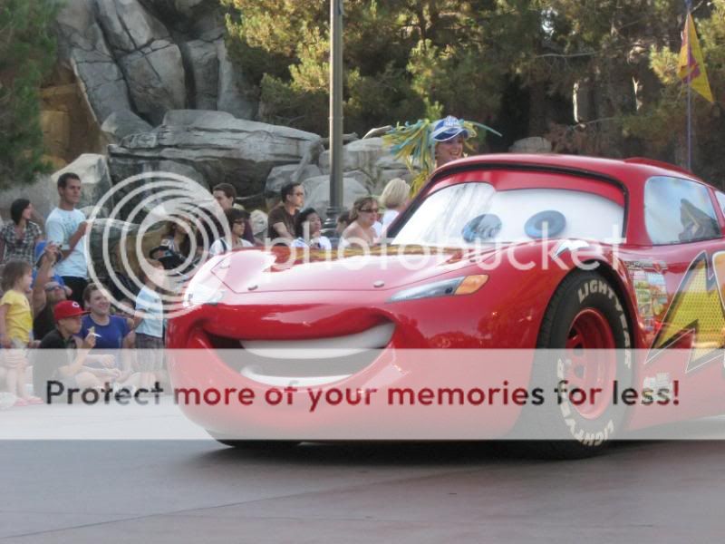 Cars star Lightning McQueen leads the parade.